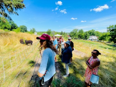 a group of people experiencing a farm tour