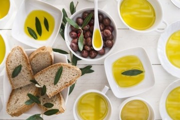 various bowls of olive oil with bread