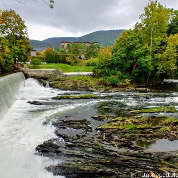 a large waterfall over a body of water