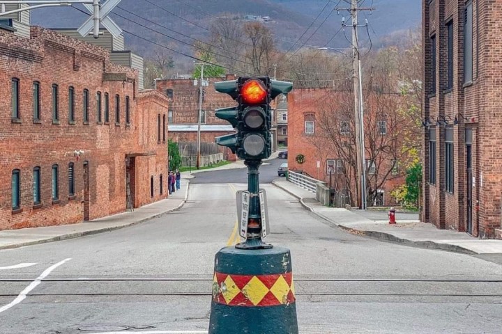 a traffic light sitting on the side of a road