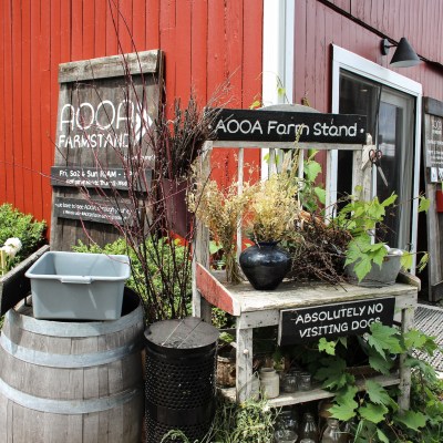 a house that has a sign on the side of a building