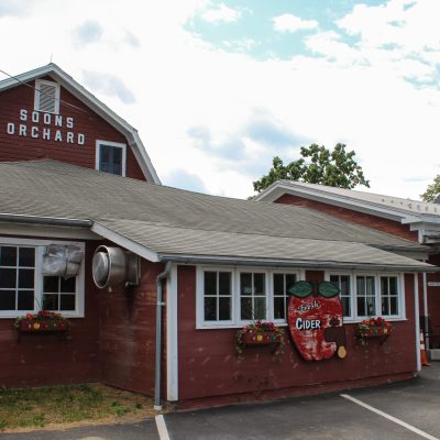 a house that has a sign on the side of a building