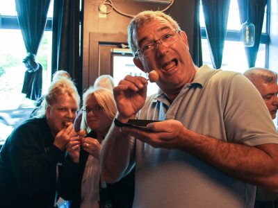 a man happily trying a sample of food