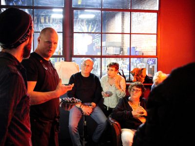 a group of people standing next to a window