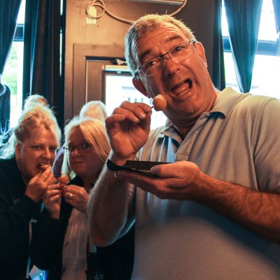 a man drinking from a wine glass