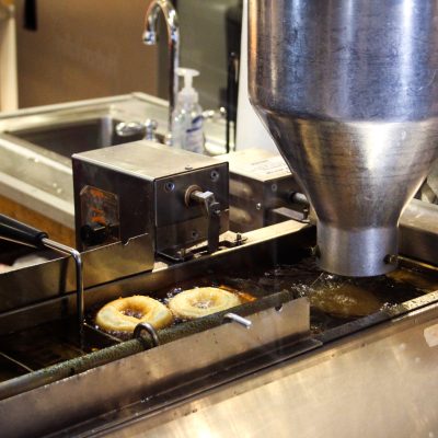 a large commercial kitchen with stainless steel appliances