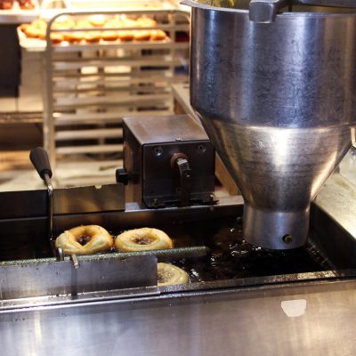 a large commercial kitchen with stainless steel appliances