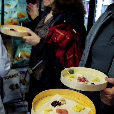 a woman sitting at a table with a plate of food