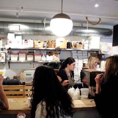 a group of people preparing food in a kitchen