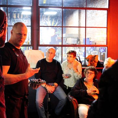 a group of people standing next to a window