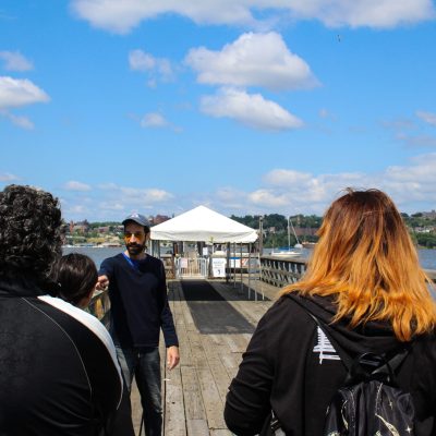a group of people standing on a beach