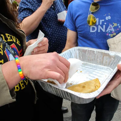 a person holding a plate of food