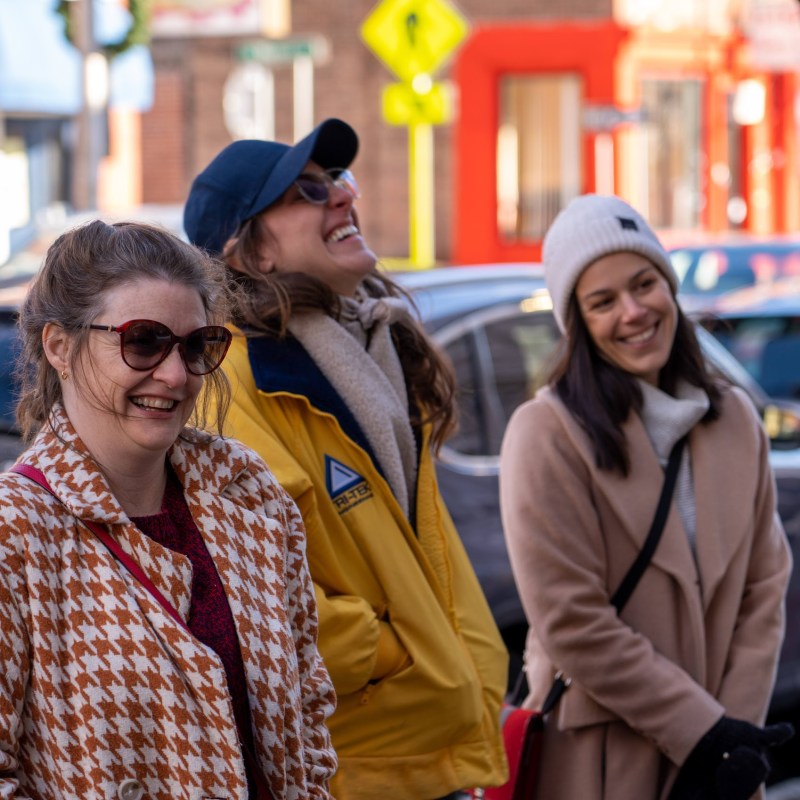 a couple of people that are standing in the street