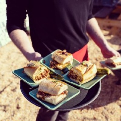a person holding a plate of food