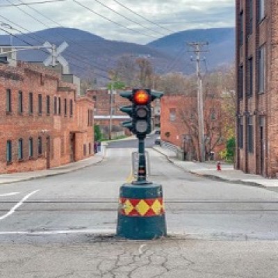 a traffic light sitting on the side of a road